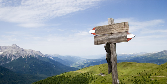 Sign posts on the top of an alpine peak