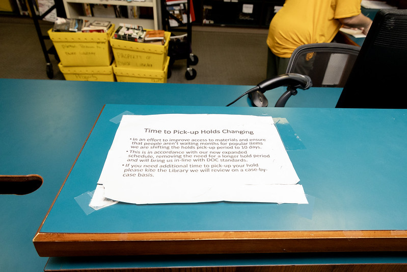 54623071913_71489a4259_c (1) A piece of paper taped to the counter extending the amount of time that holds will be held.
