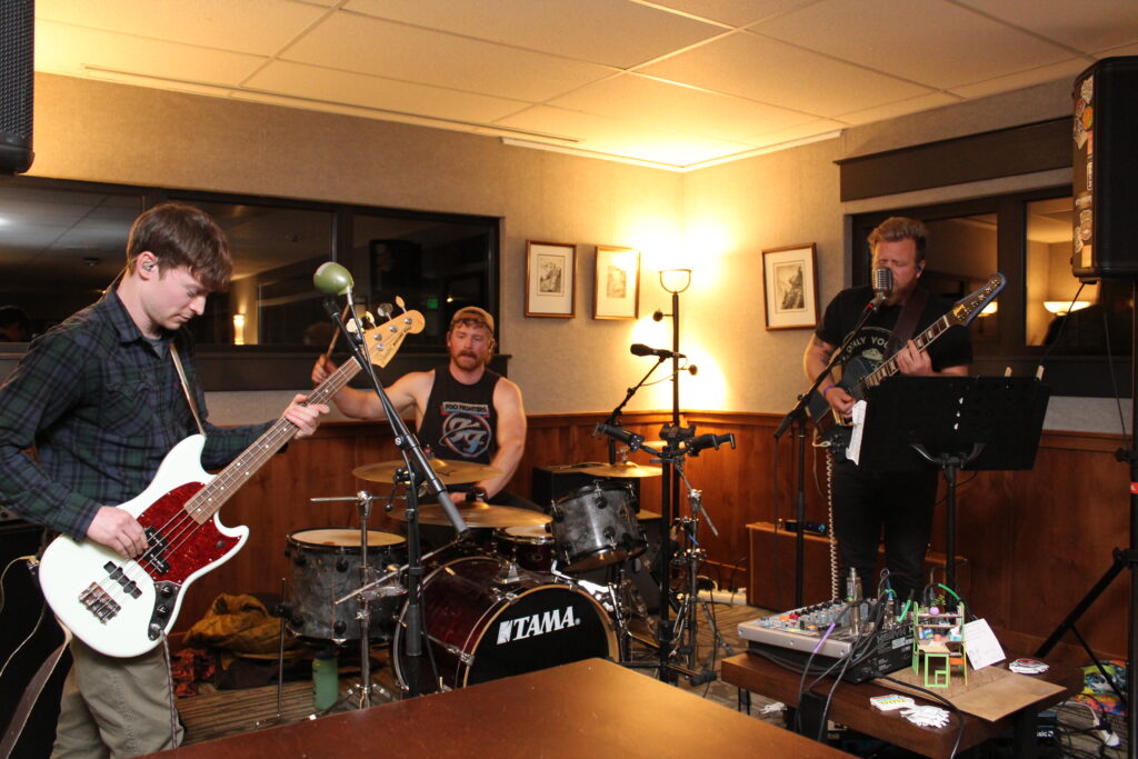 The band, Jingle Jangle Jabroni, performs in the quiet room.