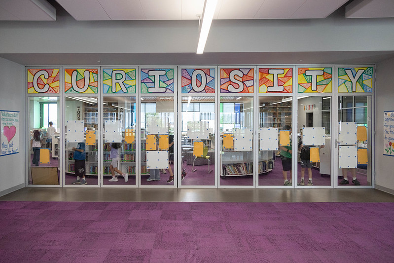 Looking into the Curiosity Center where students select the posters they would like to win.